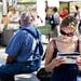 Saline resident Megan Foster reads a magazine while checking out the Art Fair on South University Avenue on Saturday, July 20. Daniel Brenner I AnnArbor.com